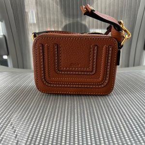 Mini Cloe coin purse that fits cards and lipsticks etc… super cute!